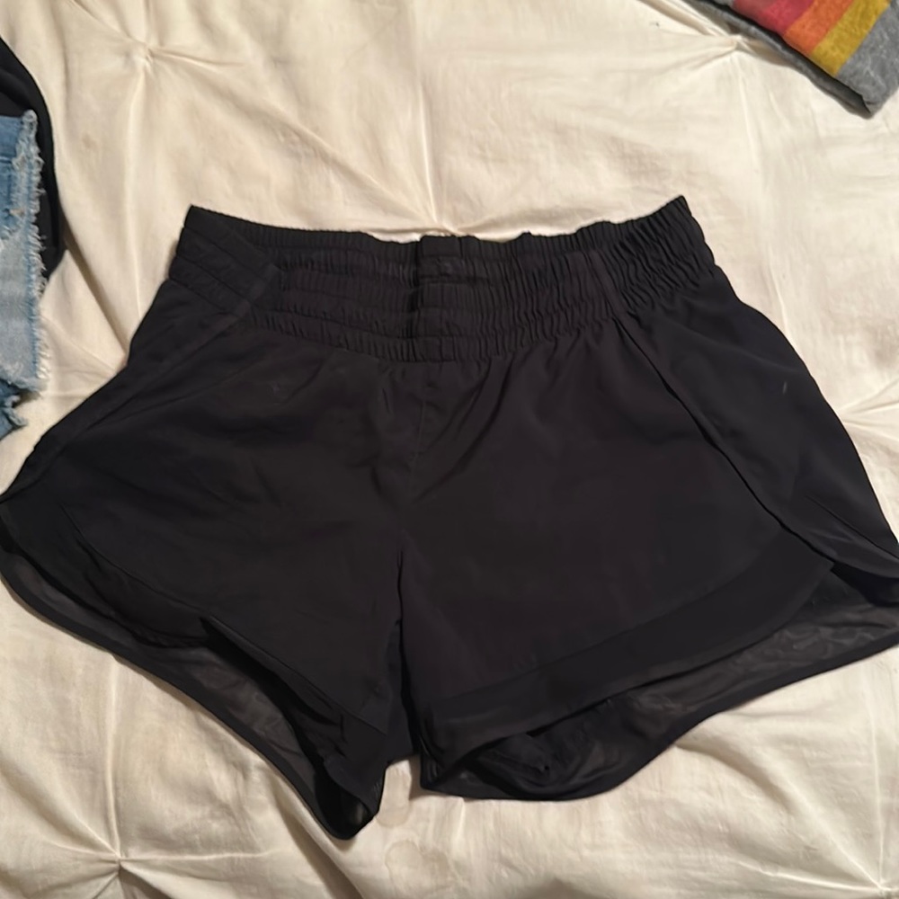 Black Athleta mesh racer run short. Size small.